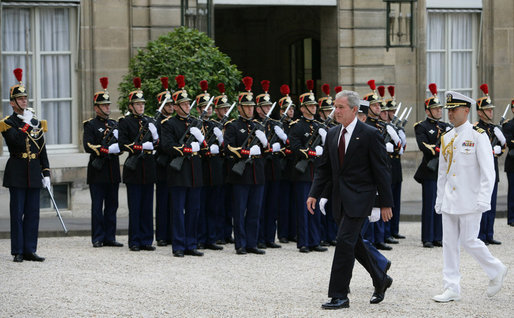 President George W. Bush reviews an honor guard as he arrives to meet French President Nicolas Sarkozy for a dinner Friday evening, June 13, 2008, at the Elysee Palace in Paris. White House photo by Chris Greenberg