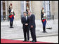President George W. Bush is welcomed by French President Nicolas Sarkozy for a dinner Friday evening, June 13, 2008, at the Elysee Palace in Paris. White House photo by Eric Draper