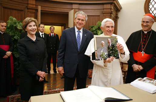President George W. Bush and Laura Bush present Pope Benedict XVI with a framed photograph Friday, June 13, 2008, during their visit to the Vatican. The photo shows President Bush and Pope Benedict XVI together at the White House during the Pope's visit in April. White House photo by Shealah Craighead