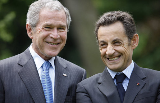 President George W. Bush and French President Nicolas Sarkozy spend a few moments together talking during a sculpture unveiling Saturday, June 14, 2008 at the U.S. Ambassador's residence in Paris. White House photo by Eric Draper