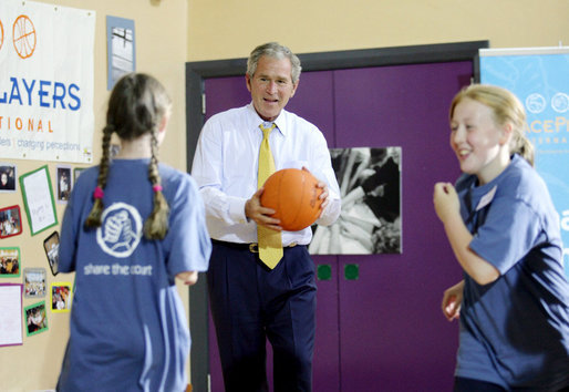 President George W. Bush participates in a basketball game Monday. June 16, 2008, during a visit to the Lough Integrated Primary School in Belfast, Ireland. White House photo by Shealah Craighead