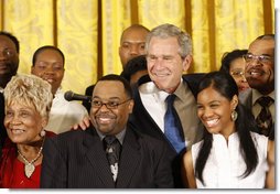 President George W. Bush joins singers Narcissus Brown, left, Kurt Carr, Spensha Baker and Walter Hawkins on stage in the East Room of the White House, follwing their performances Tuesday, June 17, 2008, in honor of Black Music Month.  White House photo by Eric Draper