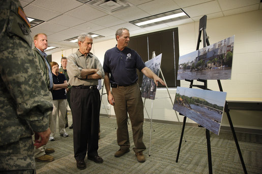 President George W. Bush is briefed on the Midwest flooding by Dick Hainje, Regional Administrator for the Federal Emergency Management Agency, during a visit Thursday, June 19, 2008, to Cedar Rapids, Iowa. The President spent the day touring the devastation left in the wake of the flooding Cedar and Iowa rivers. White House photo by Eric Draper