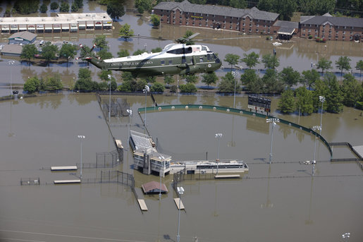 Marine One with President George W. Bush aboard flies over a flooded University of Iowa softball complex in Iowa City Thursday, June 19, 2008, during his aerial tour of the region. White House photo by Eric Draper