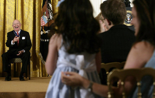 Laurence Silberman laughs as he acknowledges a standing ovation by a young girl in the audience Thursday, June 19, 2008, after he was presented the 2008 Presidential Medal of Freedom by President George W. Bush in the East Room of the White House. White House photo by David Bohrer