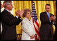 Mrs. Annette Lantos, wife of the late Mr. Tom Lantos, receives applause in honor her husband who was awarded the Presidential Medal of Freedom Thursday, June 19, 2008, in the East Room of the White House. White House photo by Shealah Craighead