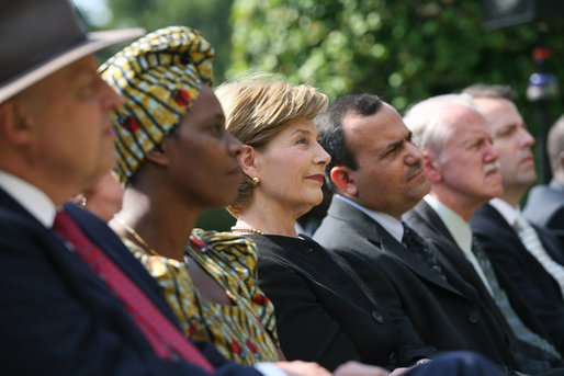 Mrs. Laura Bush listens to participants during a celebration of World Refugee Day Friday, June 20, 2008, in the East Garden of the White House. The event acknowledged the compassion of the American people in welcoming refugees into U.S. society and highlighting their contributions. White House photo by Shealah Craighead