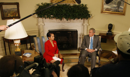 President George W. Bush welcomes President Gloria Macapagal-Arroyo of the Republic of the Philippines to the Oval Office Tuesday, June 24, 2008, at the White House. The President expressed deep condolences for those affected by Typhoon Fengshen saying, "We, the American people, care about the human suffering that's taking place, and we send our prayers." White House photo by Eric Draper