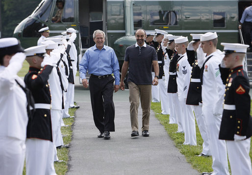 President George W. Bush walks with Crown Prince Sheikh Mohammed bin Zayed Al Nahyan of Abu Dhabi, UAE, through an honor guard upon his arrival to Camp David, Thursday, June 26, 2008 in Camp David, Md. White House photo by Eric Draper