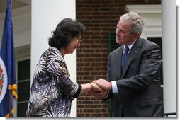 President George W. Bush shakes hands with new United States Citizens at Monticello's 46th Annual Independence Day Celebration and Naturalization Ceremony Friday, July 4. 2008, in Charlottesville, VA.  White House photo by Joyce N. Boghosian