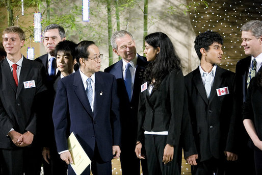 President George W. Bush and Japanese Prime Minister Yasuo Fukuda speak with United States J-8 representative Manogna Manne of Pleasanton, Calif., a member of the J-8 young leaders from the Group of Eight countries, attending the 2008 G-8 Summit in Toyako, Japan. White House photo by Eric Draper