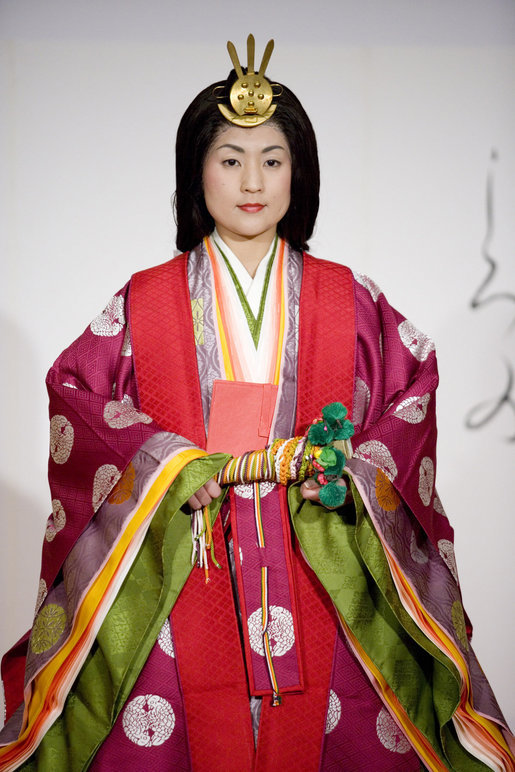A young woman models a Junihitoe, a 12-layered formal court dress worn by women during the Heian period, during a demonstration of traditional Japanese culture Monday for G-8 spouses at the Windsor Hotel Toya Resort and Spa in Toyako, Japan. White House photo by Shealah Craighead