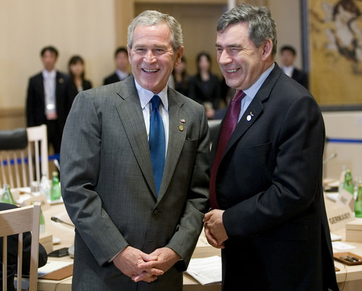 President George W. Bush and Prime Minister Gordon Brown of the United Kingdom, share a moment Tuesday, July 8, 2008, prior to the morning's G-8 Working Session at the Windsor Hotel Toya Resort and Spa in Toyako, Japan. White House photo by Eric Draper