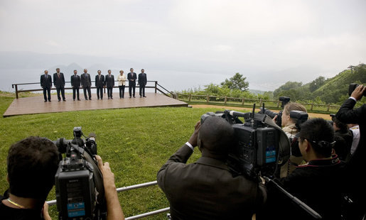 Photographers train their lenses on the G-8 leaders Tuesday, July 8, 2008, as they pose for the official family photograph in Toyako, Japan. In the background is Lake Toya. White House photo by Eric Draper