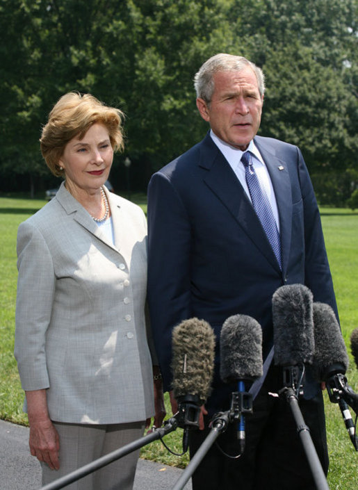 President George W. Bush and Mrs. Laura Bush meet with reporters Sunday, July 13, 2008 upon their arrival back to the White House, to express their sadness on the death of former White House Press Secretary Tony Snow. White House photo by Joyce N. Boghosian