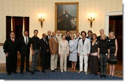 Mrs. Laura Bush poses with the winners of the 2008 Cooper-Hewitt National Design Awards at the White House on July 14, 2008. The awards are given in various disciplines such as communications, architecture, landscape, product, interior, fashion and people's design as well as in lifetime achievement, corporate achievement, special jury commendation. They awards are a tool to increase national awareness of design by promoting excellence, innovation and lasting achievement. The award program was first launched in 2000 at the White House as an official project of the White House Millennium Council. White House photo by Shealah Craighead