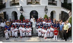 President George W. Bush and Mrs. Laura Bush stand with the All-Star Tee Ball teams and participants on the South Portico Wednesday, July 16, 2008, following a double-header at the White House, pitting Eastern U.S. against Central U.S. and Southern U.S. against Western U.S. White House photo by Eric Draper