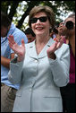 Mrs. Laura Bush shows her enthusiasm for the spirited game of tee ball as young All-Star players from across the United States gather to play on the White House South Lawn on July 16, 2008. President George W. Bush watched the game a few seats away on a bleachers set up for the event for the young players. White House photo by Shealah Craighead