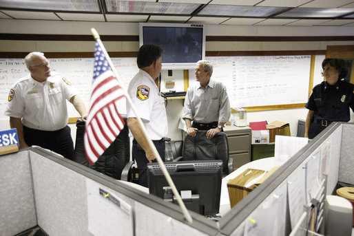 President George W. Bush speaks with public safety personnel during a visit to the wildfire command center Thursday, July 17, 2008 in Redding, Calif., where President Bush was briefed on the wildfire damage in Northern California. White House photo by Eric Draper