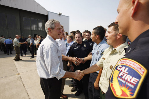 President George W. Bush, joined by California Governor Arnold Schwarzenegger, meets and thanks California public safety personnel Thursday, July 17, 2008 in Redding, Calif., for their efforts in battling the wildfires in Northern California. White House photo by Eric Draper