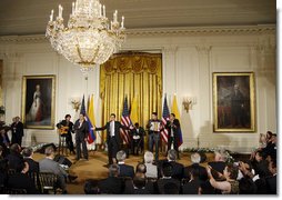 Jorge Celedon, Jimmy Zambrano, and their performance group perform during the celebration of Colombian Independence Day Tuesday, July 22, 2008, in the East Room of the White House. White House photo by Eric Draper