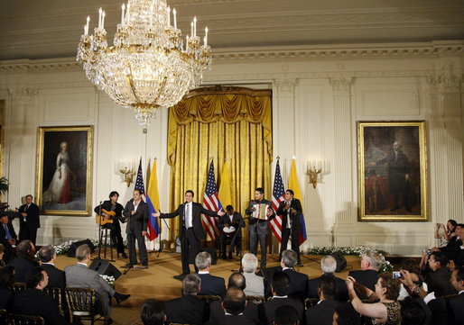 Jorge Celedon, Jimmy Zambrano, and their performance group perform during the celebration of Colombian Independence Day Tuesday, July 22, 2008, in the East Room of the White House. White House photo by Eric Draper