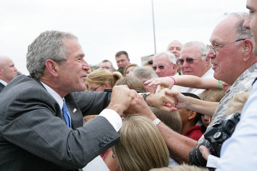 President George Bush greets military personnel and families upon departure from the Greater Peoria Regional Airport - Air National Guard Ramp in Peoria, IL Friday, July 25, 2008. White House photo by Chris Greenberg