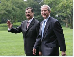 President George W. Bush walks with Pakistani Prime Minister Syed Yousaf Raza Gillani from the Oval Office to deliver their remarks Monday, July 28, 2008, on the South Lawn of the White House. White House photo by Chris Greenberg