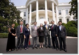 President George W. Bush poses for a photo at the South Portico entrance to the White House Tuesday, July 28, 2008, with Chinese Human Rights Activists, from left, Ciping Huang, Wei Jingsheng, Sasha Gong, Alim Seytoff, interpreter; Rebiya Kadeer, Harry Wu and Bob Fu, following their meeting at the White House.  White House photo by Eric Draper
