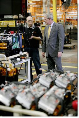 President George W. Bush speaks with a worker during his tour of the Lincoln Electric Company in Euclid, Ohio, on Tuesday, July 29, 2008, where President Bush also addressed remarks on energy and economic issues. White House photo by Chris Greenberg