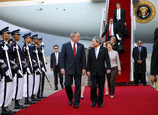 President George W. Bush and Mrs. Laura Bush are welcomed on their arrival Tuesday, Aug. 5, 2008 to Seoul Airbase, outside Seoul, by Korean Minister of Foreign Affairs and Trade Myung-hwan Yu. White House photo by Eric Draper