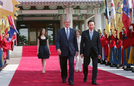 President George W. Bush walks with President Lee Myung-bak of the Republic of Korea, along with Mrs. Laura Bush and Barbara Bush, as they arrive at the Blue House, the presidential residence, Wednesday, Aug. 6, 2008, in Seoul. White House photo by Chris Greenberg