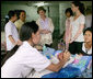 Mrs. Laura Bush and daughter Barbara Bush talk with a nurse Thursday, Aug. 7, 2008 at Mae Tao Clinic at the Mea La Refugee Camp which provides free treatment for the sick and wounded Burmese migrant workers in Mae Sot, Thailand. White House photo by Shealah Craighead