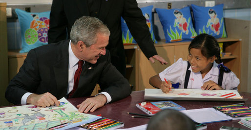 President George W. Bush visits with children on August 7, 2008, in Bangkok at the Human Development Foundation - Mercy Centre, a non-profit organization which helps the children and communities of the many slums of Bangkok. The group builds and operates schools, works on issues concerning family health and welfare – such as protecting street children's rights and combating AIDS. The President followed the event by dealing with the issues of Burmese disaster relief and meeting with Burmese activists and media before heading to China. White House photo by Chris Greenberg