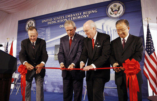 President George W. Bush and former President George H.W. Bush join U.S. Ambassador to China Sandy Randt and Dai Bingguo, People’s Republic of China State Councilor, as they participate in a ribbon-cutting ceremony Friday, Aug. 8, 2008, at the U.S. Embassy in Beijing. White House photo by Eric Draper