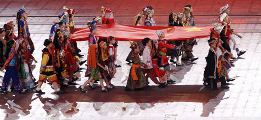 Young performers carry a Chinese flag into National Stadium Friday Aug.8, 2008, during the Opening Ceremonies of the 2008 Summer Olympic Games in Beijing. White House photo by Eric Draper
