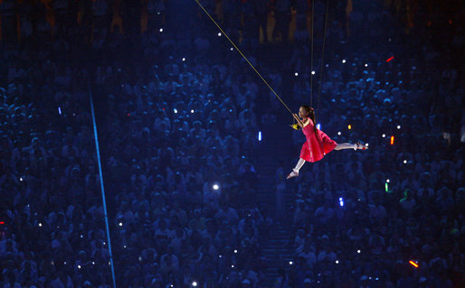 A young performer is suspended through the air during the Opening Ceremonies of the 2008 Summer Olympic Games Friday, Aug. 8, 2008, at the National Stadium in Beijing. White House photo by Eric Draper