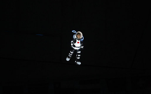 An aerial performance artist in an astronaut costume glides above National Stadium Friday evening, Aug. 8, 2008 in Beijing, during the Opening Ceremonies of the 2008 Summer Olympics. White House photo by Eric Draper