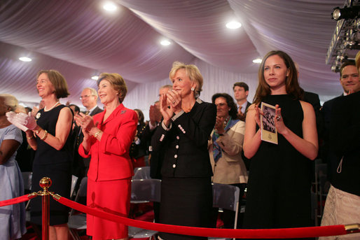 Mrs. Laura Bush stands with Mrs. Sarah Randt, spouse of U.S. Ambassador to China Sandy Randt, left, Mrs. Anne Johnson, Director of Art in Embassies Program, and Ms. Barbara Bush during applause for President George W. Bush Friday, Aug. 8, 2008, at the dedication ceremony for the U.S. Embassy in Beijing. White House photo by Shealah Craighead