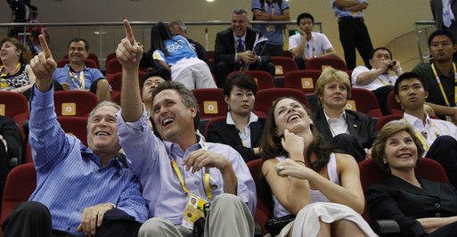 President George W. Bush is joined by his brother, Marvin Bush, daughter, Ms. Barbara Bush and Mrs. Laura Bush as they attend the U.S. Women's Olympic Basketball Team's match Saturday, Aug. 9, 2008, against the Czech Republic team at the Beijing 2008 Summer Olympics Games. White House photo by Eric Draper