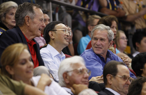 President George W. Bush attends the U.S. Olympic Men's Basketball Team's game against China with his father, former President George H.W. Bush and China's Foreign Minster Yang Jiechi Sunday, Aug. 10, 2008, at the 2008 Summer Olympic Games in Beijing. White House photo by Eric Draper