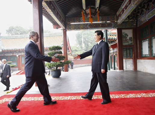 President George W. Bush is welcomed by China's President Hu Jintao upon his arrival Sunday, Aug. 10, 2008 to Zhongnanhai, the Chinese leaders compound in Beijing. White House photo by Eric Draper