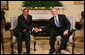 President George W. Bush shakes hands with Tanzania President Jakaya Kikwete in the Oval Office at the White House Friday, Aug. 29, 2008, during their meeting with reporters. White House photo by Chris Greenberg