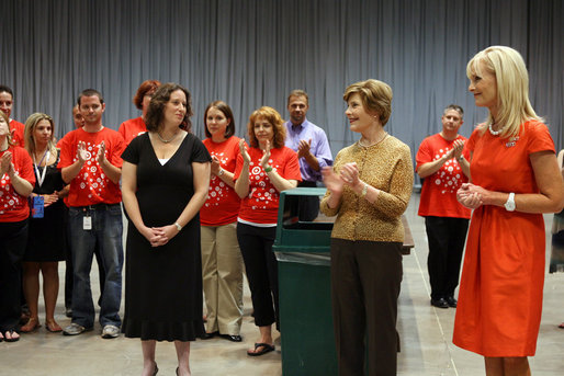 Mrs. Laura Bush and Mrs. Cindy McCain applaud the efforts of volunteers who are setting up a space in Minneapolis Convention Center Monday, September 1, 2008, to assemble and ship out care kits to support the victims of Hurricane Gustav. White House photo by Shealah Craighead