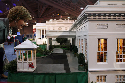 Mrs. Laura Bush peers through the windows of West Wing on a detailed recreation of the White House during a visit Tuesday, Sept. 2, 2008, to CivicFest: A Very Minnesota Celebration, at the Minneapolis Civic Center. Created by John and Jan Zweifel, the replica was created using photographs, published drawings and memories from frequent public tours and is part of a vibrant civic festival celebrating Minnesota and American history, democracy and the U.S. Presidency. White House photo by Shealah Craighead