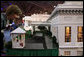 Mrs. Laura Bush peers through the windows of West Wing on a detailed recreation of the White House during a visit Tuesday, Sept. 2, 2008, to CivicFest: A Very Minnesota Celebration, at the Minneapolis Civic Center. Created by John and Jan Zweifel, the replica was created using photographs, published drawings and memories from frequent public tours and is part of a vibrant civic festival celebrating Minnesota and American history, democracy and the U.S. Presidency. White House photo by Shealah Craighead