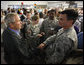 President George W. Bush greets military personnel who assisted with Hurricane Gustav emergency response during his briefing Wednesday, Sept. 3, 2008, at the Louisiana State Emergency Operations Center in Baton Rouge. Acknowledging the response and coordination efforts, the President said, "State government, the local government and the federal government were able to work effectively together." White House photo by Eric Draper