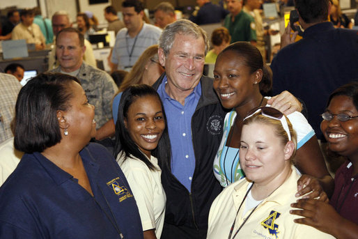 President George W. Bush stands with workers inside the Louisiana State Emergency Operations Center Wednesday, Sept. 3, 2008, in Baton Rouge. Speaking to all those who came to the aide in the wake of Hurricane Gustav, the President said, "I want to thank all the volunteers and the faith-based community that always rises up in a challenge like this. They listen to that universal call to love a neighbor. And that's happening here in Louisiana again." White House photo by Eric Draper