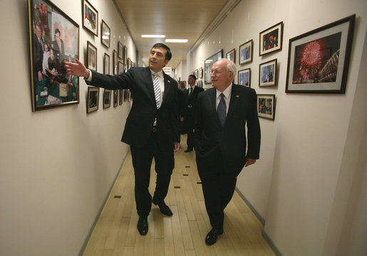 Vice President Dick Cheney and Georgian President Mikheil Saakashvili look at photographs adorning the hallways of the presidential complex Thursday, Sept. 4, 2008, in Tbilisi. White House photo by David Bohrer