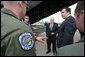 Members of the 37th Airlift Squadron, the Blue Tail Flies, talk with Vice President Dick Cheney and Georgian President Mikheil Saakashvili Thursday, Sept. 4, 2008 during the leaders' visit to a U.S. a relief operation center at Tbilisi International Airport, Georgia. White House photo by David Bohrer